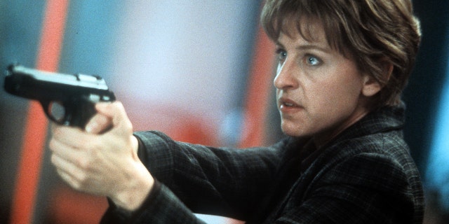 Ellen DeGeneres aiming pistol in a scene from the film 'Goodbye Lover', 1998. (Photo by Warner Brothers/Getty Images)