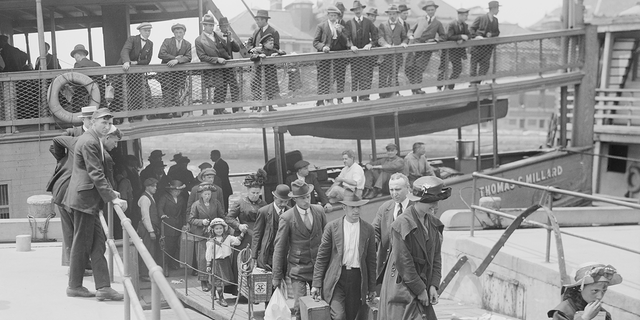 Joseph Owades' parents, Simon and Gussie Owades, arrived at Ellis Island from Eastern Europe like millions of other immigrants who came to America for a better life. Above, immigrants are shown arriving in New York City, Bain News Service, 1920.