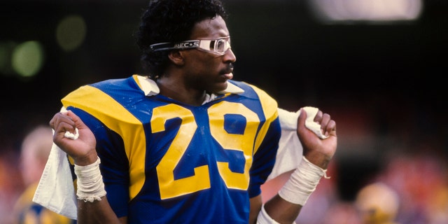 Eric Dickerson of the Los Angeles Rams waits on the sidelines against the Houston Oilers on Dec. 17, 1984, at Anaheim Stadium in Anaheim, California.