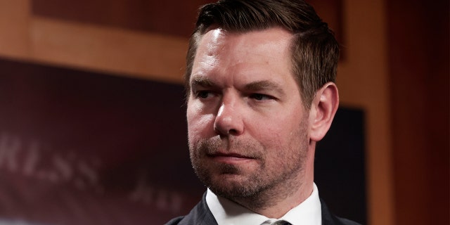 Rep. Eric Swalwell, D-Calif., listens as Sen. Jack Reed, D-R.I., speaks during a news conference about the Act to Protect Against Abusive Passengers at the U.S. Capitol Building in Washington, April 6, 2022.  .