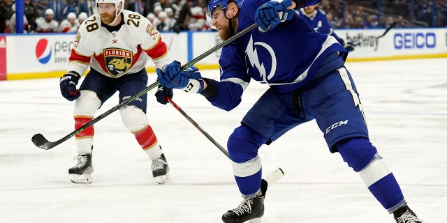 Tampa Bay Lightning defenseman Erik Cernak (81) watches his shot get past Florida Panthers goaltender Sergei Bobrovsky for a goal during the second period in Game 3 of an NHL hockey second-round playoff series Sunday, May 22, 2022, in Tampa, Fla. Looking on is Panthers' Claude Giroux (28).