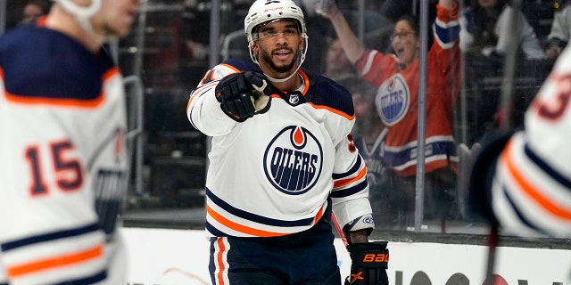 Edmonton Oilers left wing Evander Kane, center, celebrates his goal during the third period in Game 3 of an NHL hockey Stanley Cup first-round playoff series against the Los Angeles Kings Friday, May 6, 2022, in Los Angeles. It was his third goal of the game.