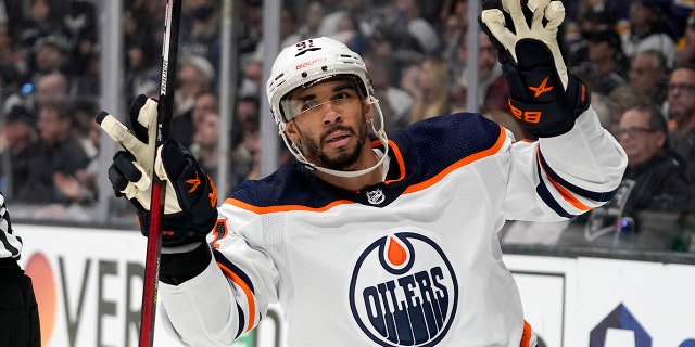 Edmonton Oilers left wing Evander Kane gestures after scoring an empty net goal during the third period in Game 6 of an NHL hockey Stanley Cup first-round playoff series against the Los Angeles Kings Thursday, May 12, 2022, in Los Angeles.