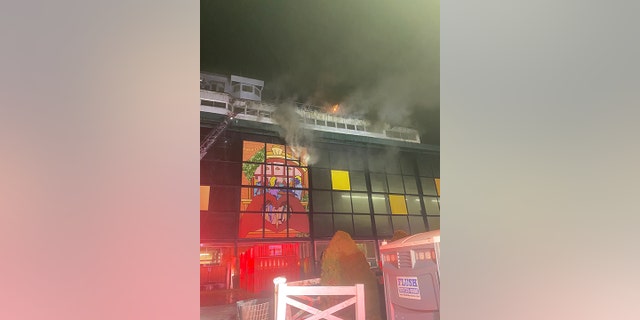 Boston firefighters battling a multi-alarm blaze at the Suffolk Downs horse racetrack on May 30, 2022.