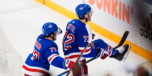 New York Rangers' Filip Chytil (72) celebrates with teammate Frank Vatrano (77) after scoring a goal during the third period of Game 5 of an NHL hockey Stanley Cup first-round playoff series against the Pittsburgh Penguins Wednesday, May 11, 2022, in New York. The Rangers won 5-3.
