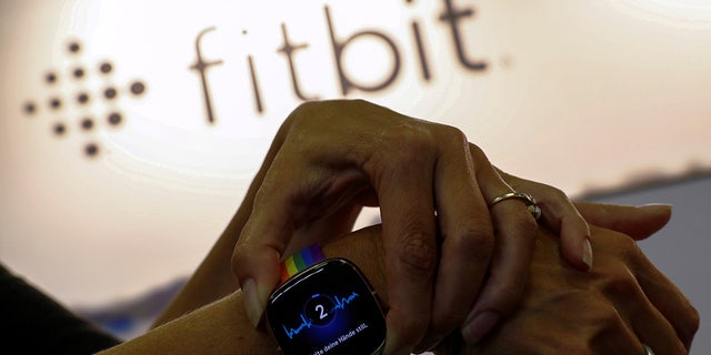 A Fitbit activity tracking watch.