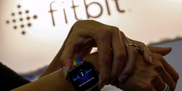 A Fitbit activity tracking watch.