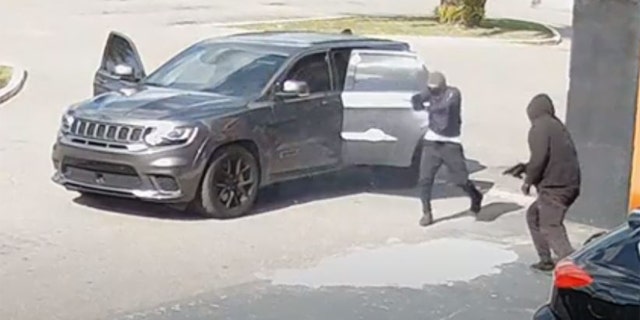 Video footage released by the Hillsborough County Sheriff's Office showing three men shoot at another car outside.