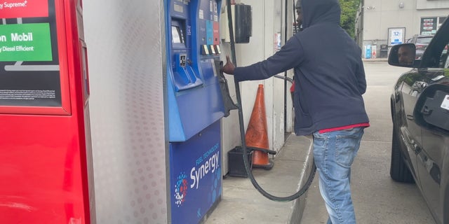 A gas station attendant fills up a customer's tank (Megan Myers/Fox News Digital)