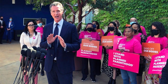 California Gov. Gavin Newsom talks at a news conference with workers and volunteers on Wednesday, May 4, 2022, at a Planned Parenthood office near downtown Los Angeles. 