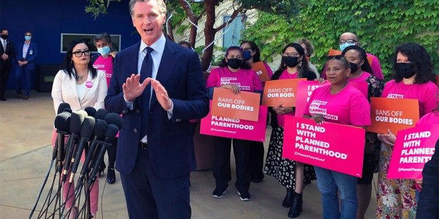 California Gov. Gavin Newsom talks at a news conference with workers and volunteers on Wednesday, May 4, 2022, at a Planned Parenthood office near downtown Los Angeles.