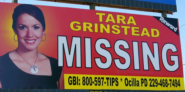 FILE - An image of Tara Grinstead is displayed on a billboard in Ocilla, Ga. Ryan Duke, charged with murdering Grinstead, a popular high school teacher who vanished in 2005, was acquitted May 20, 2022.