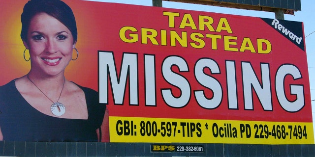 FILE - An image of Tara Grinstead is displayed on a billboard in Ocilla, Ga. Ryan Duke, charged with murdering Grinstead, a popular high school teacher who vanished in 2005, was acquitted May 20, 2022.