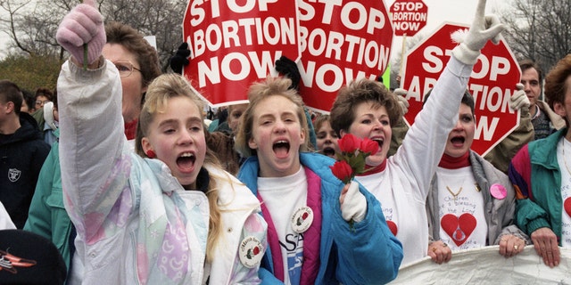 Participants in the anti-abortion rally "march for life" make their point of view known by going to the Supreme Court.  (Photo by Bettmann Archive/Getty Images)