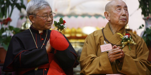 Cardinal Joseph Zen with Buddhist Master Sik Kok Kwong at a Chinese New Year gathering on March 12, 2007. (K.Y. Cheng/South China Morning Post via Getty Images)