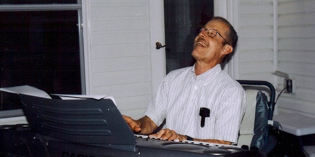 Colleagues remember Bruce Ivins, pictured in this 2004 file photo, playing the keyboard in church and at this office party, but the Justice Department says the Army microbiologist mailed anthrax-filled letters that killed five people in 2001.