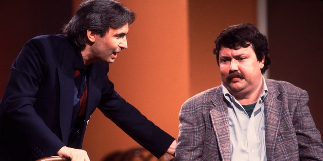 David Steinberg (left) and Mike Hagerty perform onstage during the Second City 25th anniversary performance at the Vic Theater in Chicago in December 1984.