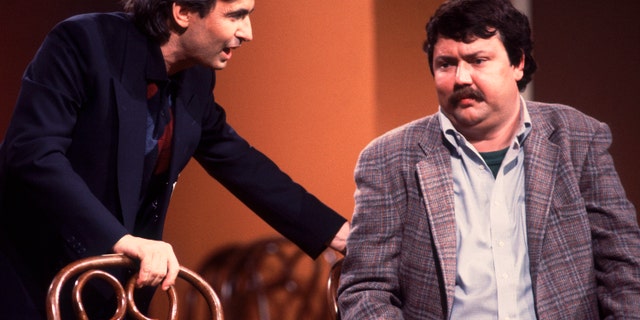 David Steinberg (left) and Mike Hagerty perform onstage during the Second City 25th anniversary performance at the Vic Theater in Chicago in December 1984.