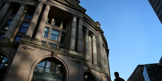 This file image shows a man approaching South Station after the evening rush in Boston, Massachusetts, on July 24, 2019.