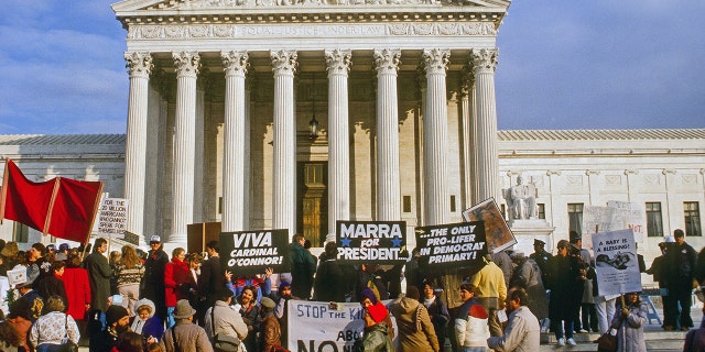 Pro life demonstrators stand in front of the US Supreme Court building during the annual Right To Life March, Washington DC, January 22, 1988. (Photo by Mark Reinstein/Corbis via Getty Images)