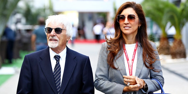 Bernie Ecclestone, Chairman Emeritus of the Formula One Group, and his wife Fabiana walk in the Paddock before the F1 Grand Prix of Russia at Sochi Autodrom on September 29, 2019, in Sochi, Russia.
