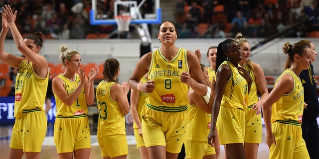 Liz Cambage (8) and her teammates react after winning the match against Puerto Rico during the FIBA Women's Olympic Qualifying Tournament match between Australia and Puerto Rico, Feb.. 8, 2020, at the Prado stadium in Bourges, Frankryk.