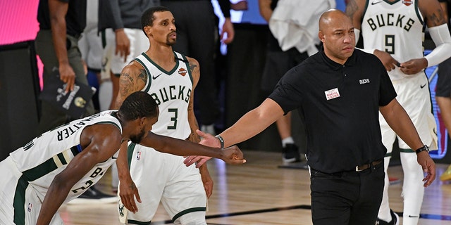 Assistant coach Darvin Ham of the Milwaukee Bucks greets a player during a game against the Miami Heat during Game 5 of the NBA Eastern Conference semifinals Sept. 8, 2020, at The Field House at ESPN Wide World Of Sports Complex in Orlando, Fla.  