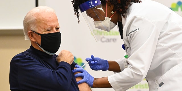 Nurse Practitioner Tabe Mase gives Joe Biden his first dose of the coronavirus vaccine on December 21, 2020.