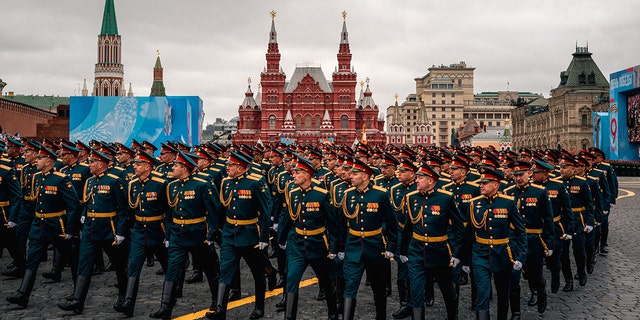Russian servicemen march along Red Square during the Victory Day military parade in Moscow on May 9, 2021. (Photo by Dimitar DILKOFF / AFP) (Photo by DIMITAR DILKOFF/AFP via Getty Images)