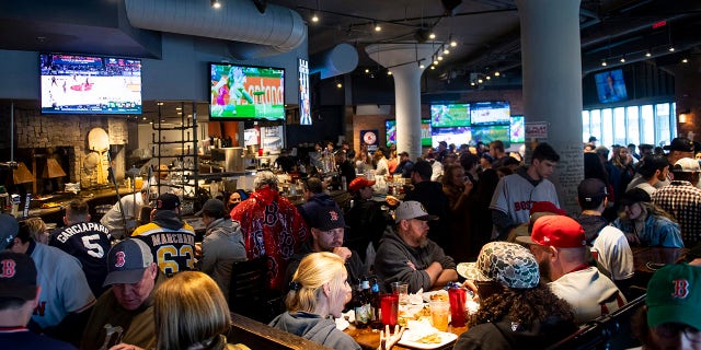 Bar patrons before a game between the Boston Red Sox and the Miami Marlins on May 29, 2021, at Fenway Park in Boston. 