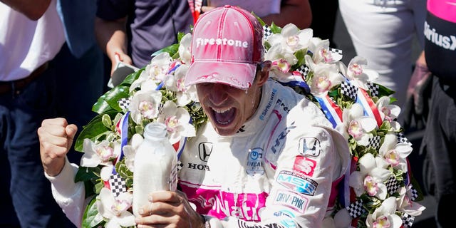 Helio Castroneves celebrates after becoming the fourth driver in history to win the Indianapolis 500 four times at Indianapolis Motor Speedway May 30, 2021, in Indianapolis.