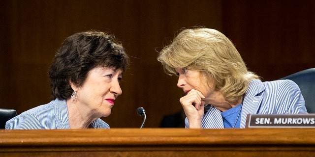 Sens. Susan Collins and Lisa Murkowski talk during the Senate Appropriations Committee hearing on June 17, 2021.