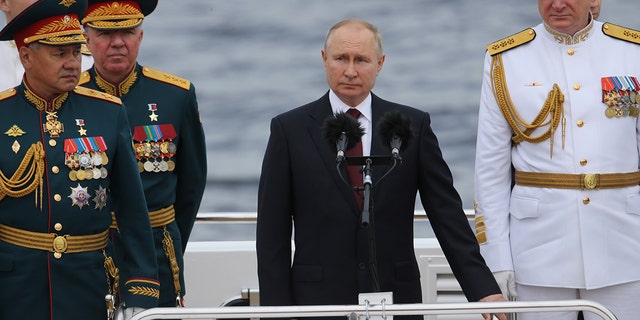 SAINT PETERSBURG, RUSSIA - JULY,25 (RUSSIA OUT): Russian President Vladimir Putin (C) seen aboard of the ship during the military parade marking the Russia's Navy Day, on July,25,2021, in Saint Petersburg, Russia. The Navy Day military parade held in St.Petersburg, despite the coronavirus (COVID-19) pandemic. (Photo by Mikhail Svetlov/Getty Images)