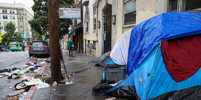 Homeless people are seen on streets of the Tenderloin district in San Francisco. On Tuesday, Mayor London Breed announced a plan to end homelessness for transgender individuals in the city. 