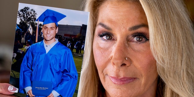 Paula Verrengia is shown at her home in Fountain Valley on Thursday, November 4, 2021, with a photo of her son Sam Doxakis on his graduation from Fountain Valley High. Doxakis died of a fentanyl overdose in March 2018.