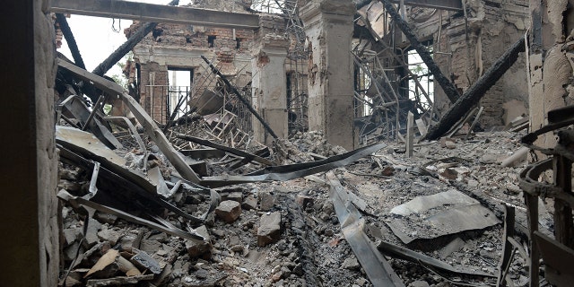TOPSHOT - This photograph shows a view of a school destroyed as a result of fighting not far from the center of the Ukrainian city of Kharkiv, located about 50 km from the Ukrainian-Russian border, on February 28, 2022. - (Photo by Sergey BOBOK / AFP) (Photo by SERGEY BOBOK / AFP via Getty Images)