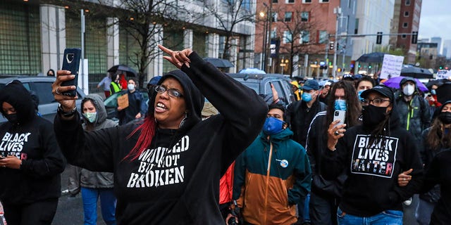 Monica Cannon-Grant leads demonstrators as they march from Nubian Square to BPD headquarters as they celebrate the conviction of former Minneapolis police officer Derek Chauvin in Boston on April 21, 2021. 