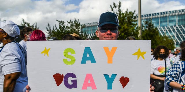 Members and supporters of the LGBTQ community attend the "Say Gay Anyway" rally in Miami Beach, Florida on March 13, 2022. - Florida's state senate on March 8 passed a controversial bill banning lessons on sexual orientation and gender identity in elementary schools, a step that critics complain will hurt the LGBTQ community. Opposition Democrats and LGBTQ rights activists have lobbied against what they call the "Don't Say Gay" law, which will affect kids in kindergarten through third grade, when they are eight or nine years old. (Photo by CHANDAN KHANNA / AFP) (Photo by CHANDAN KHANNA/AFP via Getty Images)