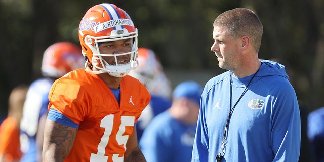 Florida head coach Billy Napier and quarterback Anthony Richardson chat Thursday during the Gators' spring practice in Gainesville. 