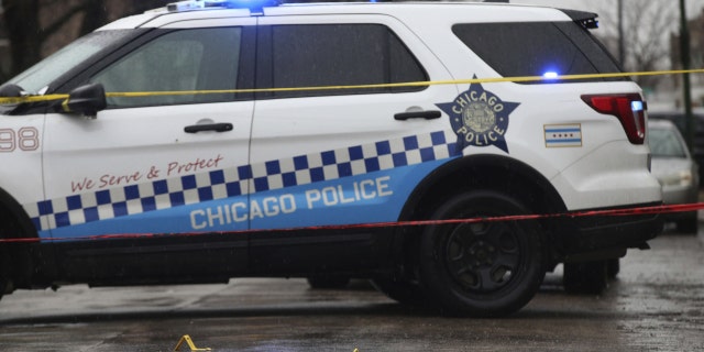 Bullet casings litter the street as police investigate the scene of a shooting on West Congress Parkway in Chicago, Tuesday, Feb. 22, 2022.