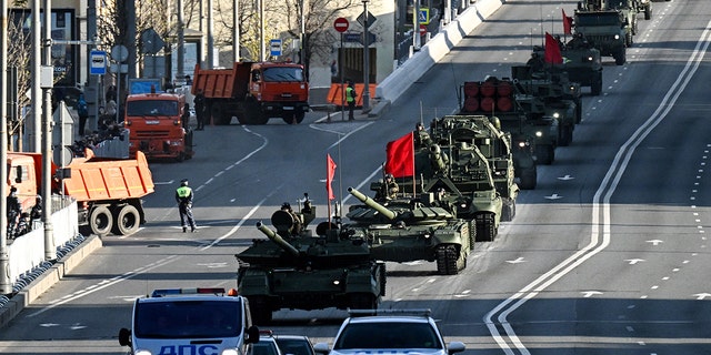 A Russian T-90M tank (front) and other military vehicles drive along the Garden Ring road towards the Red Square for a rehearsal of the Victory Day military parade, in central Moscow on May 4, 2022. (Photo by Kirill KUDRYAVTSEV / AFP) (Photo by KIRILL KUDRYAVTSEV/AFP via Getty Images)