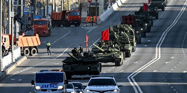 A Russian T-90M tank (front) and other military vehicles drive along the Garden Ring road towards the Red Square for a rehearsal of the Victory Day military parade, in central Moscow on May 4, 2022. (Photo by Kirill KUDRYAVTSEV / AFP) (Photo by KIRILL KUDRYAVTSEV/AFP via Getty Images)