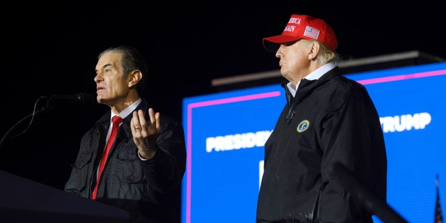 Pennsylvania Republican U.S. Senate candidate Dr. Mehmet Oz joins former President Donald Trump onstage during a rally in support of his campaign at the Westmoreland County Fairgrounds on May 6, 2022 in Greensburg, Pennsylvania. 