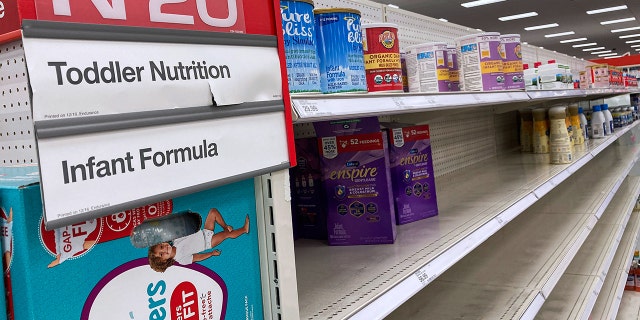 ORLANDO, FLORIDA, UNITED STATES - 2022/05/08: A nearly empty baby formula display shelf is seen at a Target store in Orlando. Stores across the United States have struggled to stock enough baby formula, causing some chains to limit customer purchases. While manufacturers report that they are producing at full capacity, it's still insufficient to meet the current demand, which has been aggravated by product recalls.