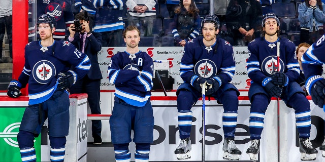 Jets listen to the closing comments of TSN broadcaster Dennis Beyak following the Seattle Kraken game at Canada Life Centre on May 1, 2022, in Winnipeg, Canada.
