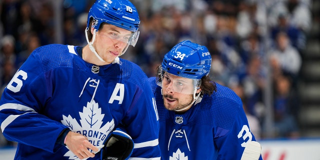 Auston Matthews, right, of the Toronto Maple Leafs talks with teammate Mitch Marner during the first period against the Tampa Bay Lightning in Game 7 of the first round of the 2022 Stanley Cup Playoffs at Scotiabank Arena May 14, 2022, in Toronto. 