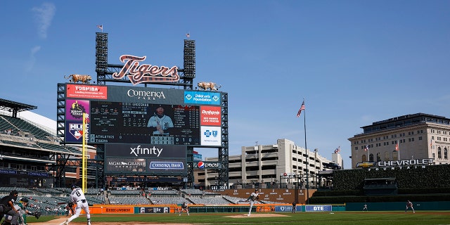 General view of the ballpark and scoreboard as Oakland Athletics starting pitcher Adrian Martinez (55) delivers a pitch to Detroit Tigers left fielder Robbie Grossman (8) during game two of an MLB doubleheader on May 10, 2022 at Comerica Park.