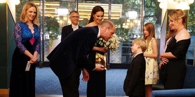 Prince William and Kate Middleton talk to family of Managing Director at Paramount Pictures UK John Fletcher during the "Top Gun: Maverick" premiere. Middleton explained that her children couldn't make it because it was a school night.