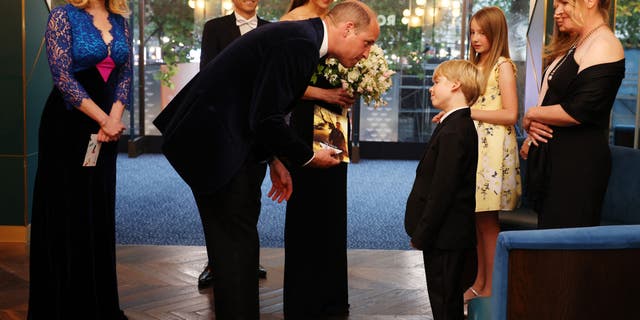 Prince William and Kate Middleton talk to family of Managing Director at Paramount Pictures UK John Fletcher during the "Top Gun: Maverick" premiere. Middleton explained that her children couldn't make it because it was a school night.