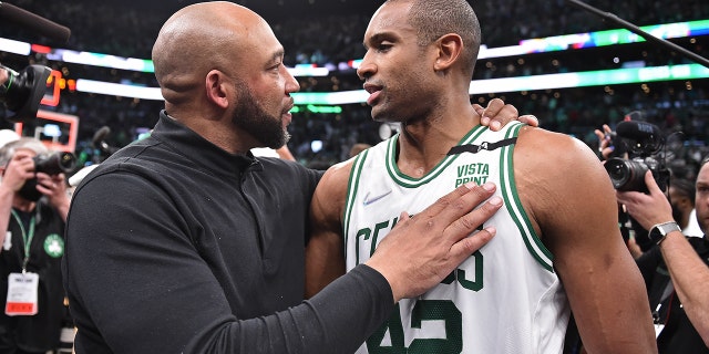 Assistant coach Darvin Ham of the Milwaukee Bucks greets Al Horford (42) of the Boston Celtics after Game 7 of the 2022 NBA Eastern Conference semifinals May 15, 2022, at the TD Garden in Boston.